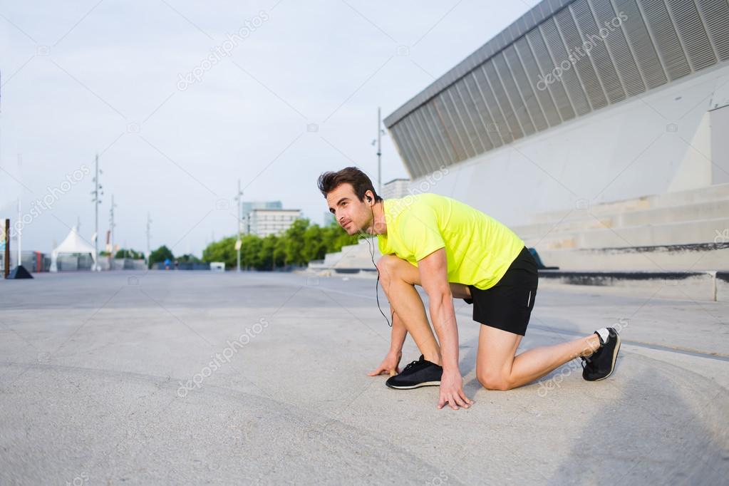 Male runner preparing for morning jogs