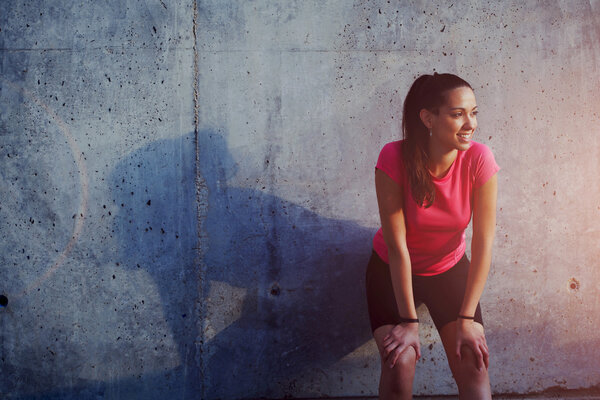 young sportswoman resting after  training