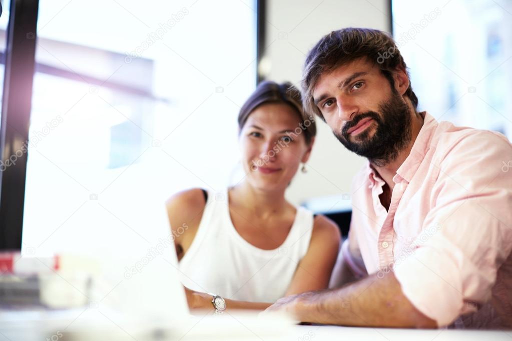 two young business people at meeting