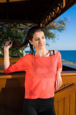 Woman enjoying a good weather on the beach
