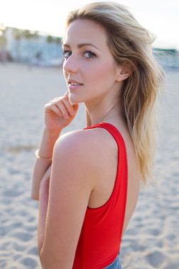 Woman posing for the camera on the beach