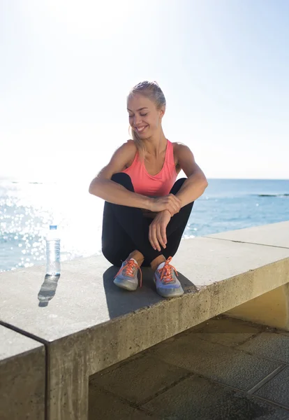 Woman jogger resting after fitness training — Stockfoto