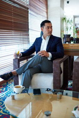 Businessman enjoying free time in restaurant