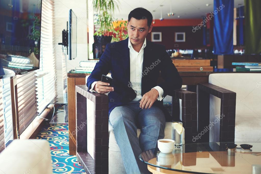 Asian businessman using mobile phone