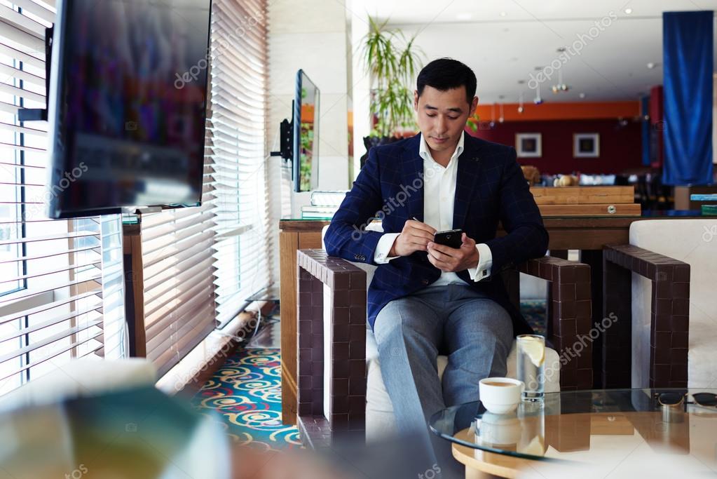 Asian businessman using mobile phone