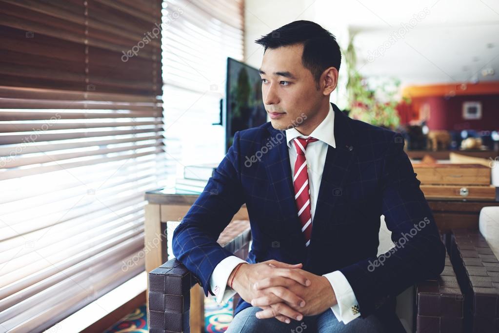 Asian businessman resting after hard work