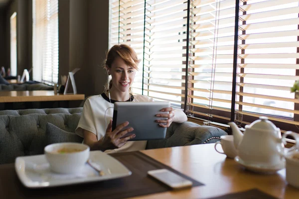 Woman have video conversation on her touch pad — 스톡 사진