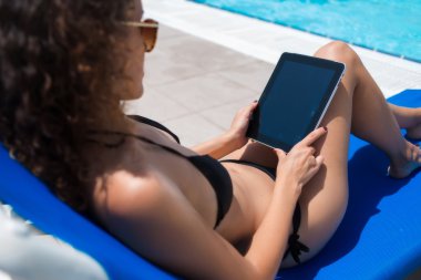 Woman using touch pad for distance job
