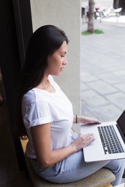 Student girl working on net-book computer