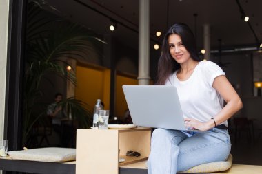 Hipster girl working on her net-book