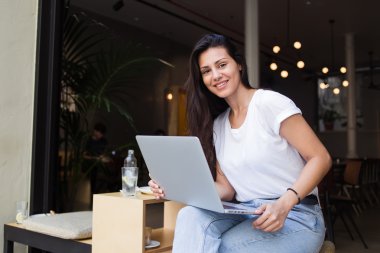 Hipster girl working on her net-book
