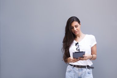 Beautiful woman using touch pad