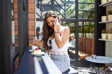 Latin woman talking on cell phone