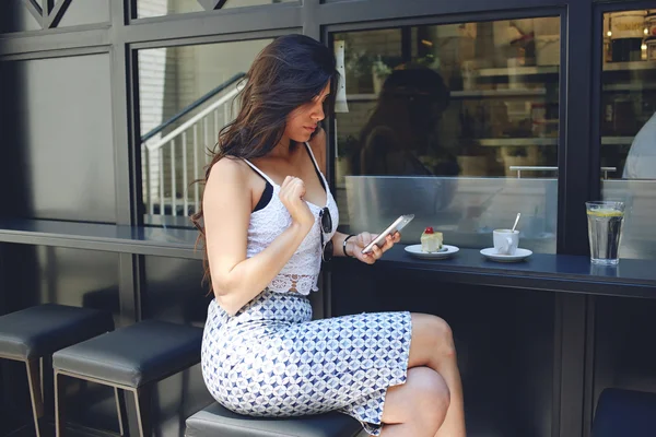 Latin woman using the mobile phone — 스톡 사진