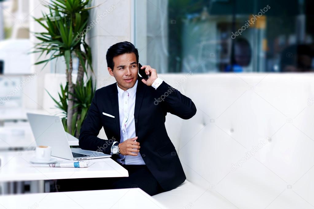 Successful businessman talking on mobile phone