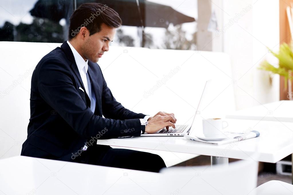 Successful businessman working on his laptop
