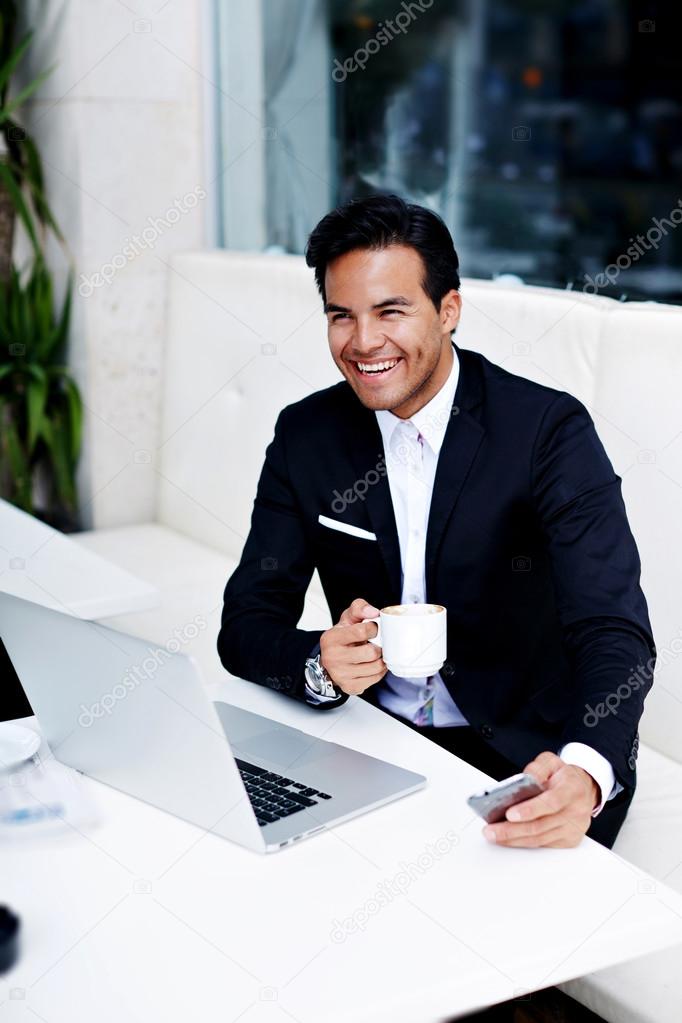 Businessman sitting front open laptop computer