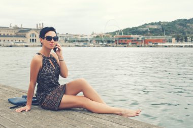 Elegant female talking on mobile phone