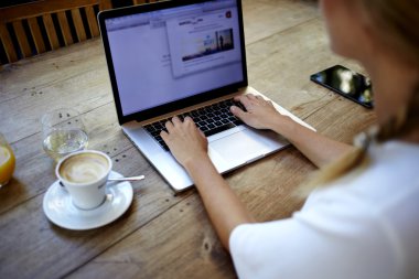 Young woman working on net-book