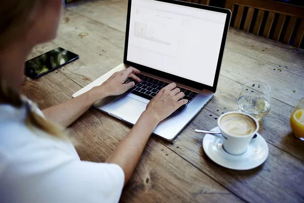 Young woman working on net-book