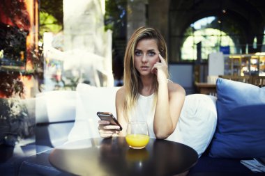 Attractive young woman using mobile phone