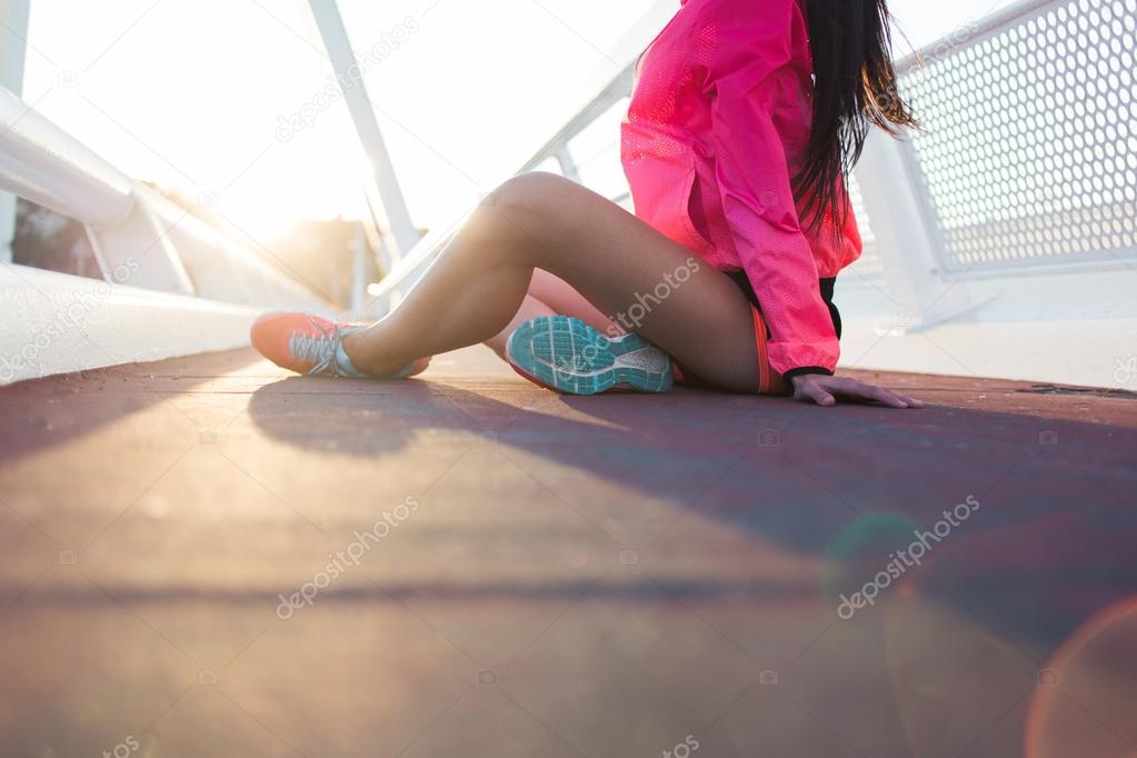 Sportswoman resting after physical exercise
