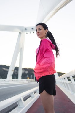 Sportswoman resting after physical exercise