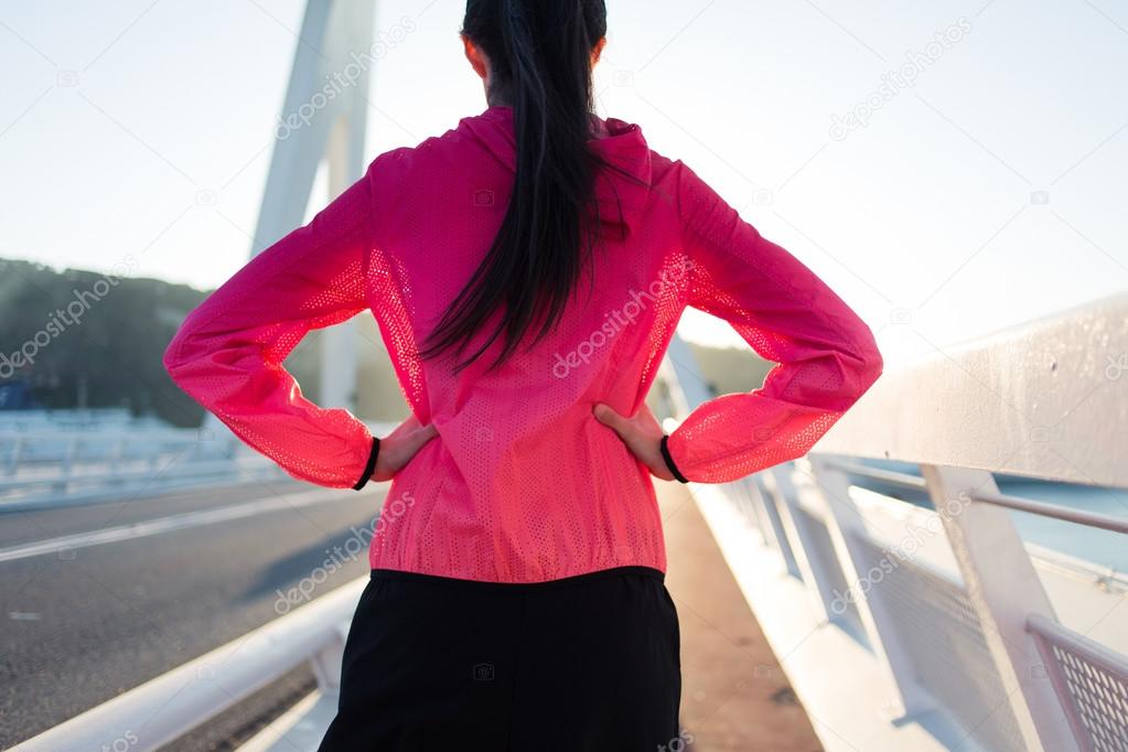 Sportswoman relaxing after physical exercise