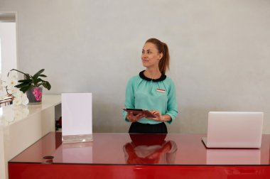 Woman working on touch pad in store