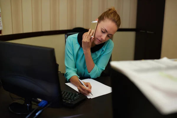 Elegant businesswoman taking on mobile phone — Stok fotoğraf