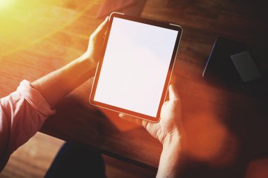 Man's hands working on touch pad