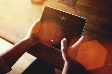 Man's hands working on touch pad