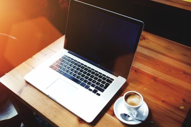 Portable net-book and cup of coffee