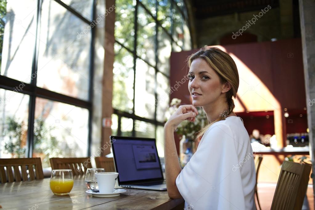 Young business woman working on laptop