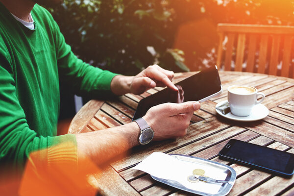Young man holding touch pad