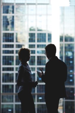 Silhouette of a two business partners