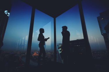 Silhouette of a two business partners