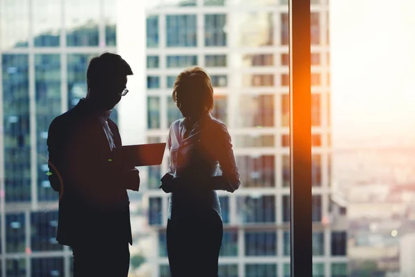 Silhouette of a two business partners