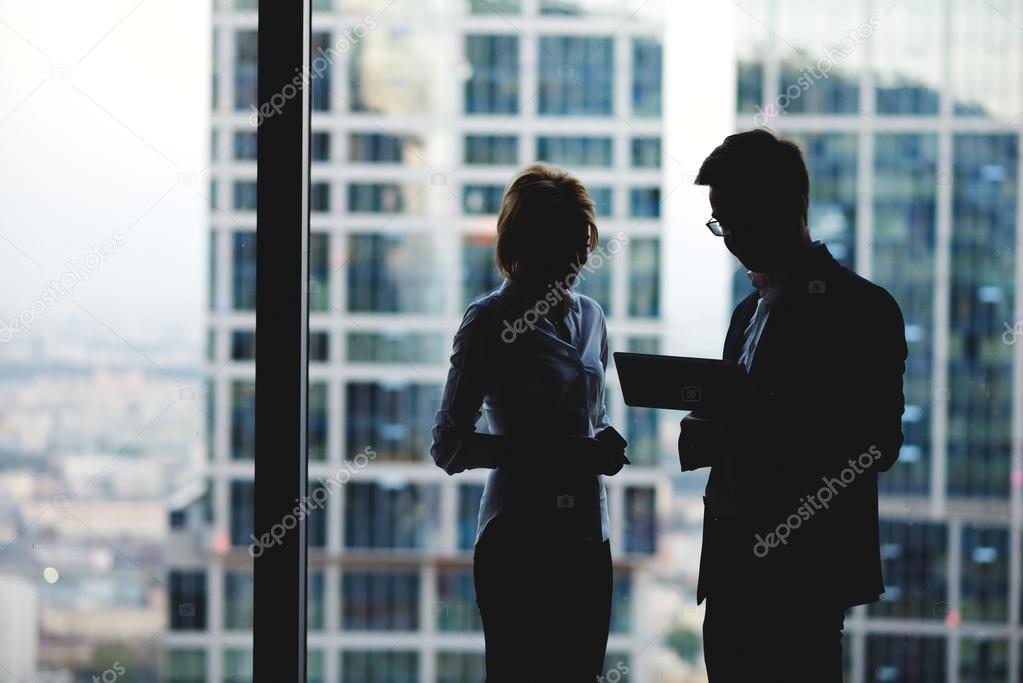 Silhouette of a two business partners