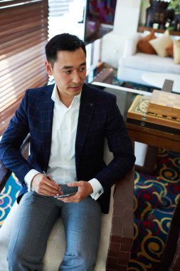 Businessman chatting on mobile phone
