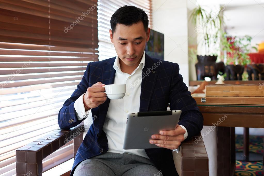 Asian businessman using touch pad
