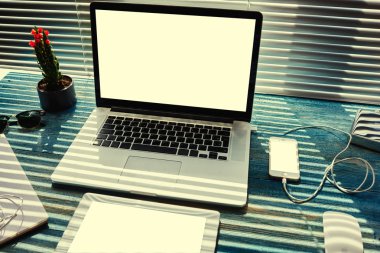 Work space with laptop computer and tablet