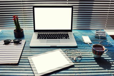 Work space with laptop computer and tablet