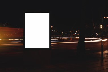 Blank billboard with night city on background