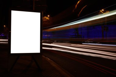 Blank billboard with night city on background