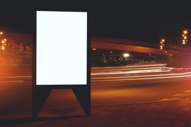 Blank billboard with night city on background