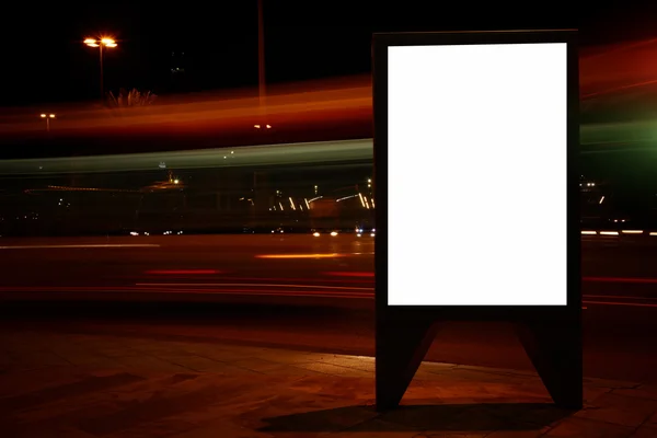 Blank billboard with night city on background — 스톡 사진