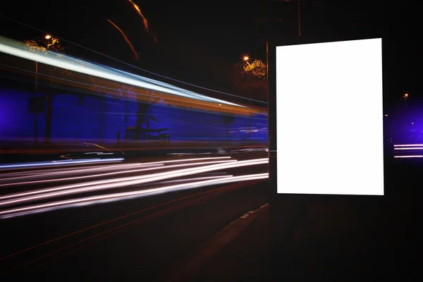 Blank billboard with night city on background — ストック写真