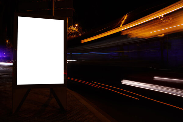 Blank billboard with night city on background