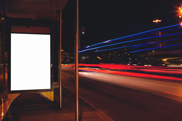 Blank billboard with night city on background